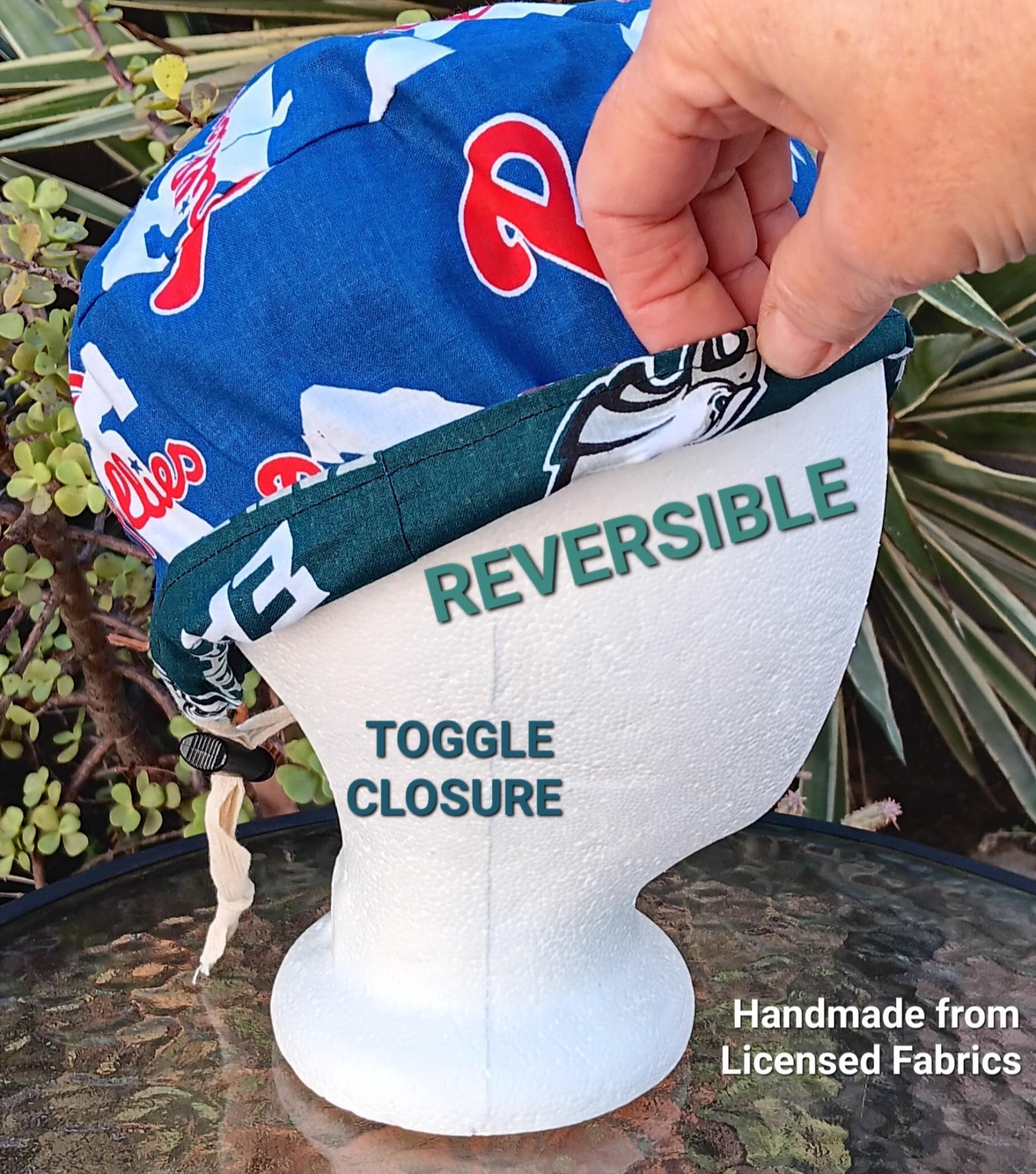 Side view of reversible Philadelphia Phillies and Eagles scrub cap. Bottom edge turned up to show the fabric on reverse. Handmade from licensed fabrics.