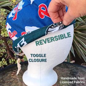 Side view of reversible Philadelphia Phillies and Eagles scrub cap. Bottom edge turned up to show the fabric on reverse. Handmade from licensed fabrics.