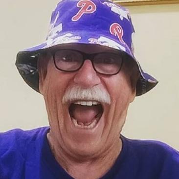 Happy with his reversible Philadelphia teams hat!