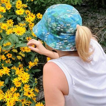 Bucket hat with 2-1/2" ponytail opening