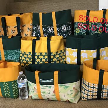 Assortment of Oakland A's bags ready to ship