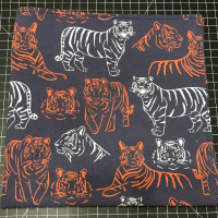 Orange and white tigers on navy blue