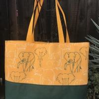 Tote bag, canvas bottom, green & white elephant outlines, hook & loop, one interior pocket, polypropylene straps
