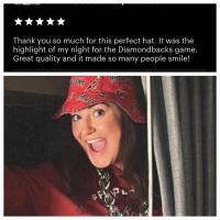 Smiling woman wearing Arizona Diamondbacks bucket hat with the red side facing out. Her 5 star review says "Thank you so much for this perfect hat."
