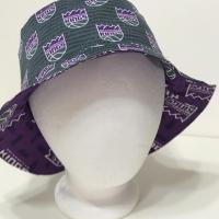 Front view, Sacramento Kings bucket hat, purple logo on grey background fabric facing out