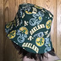 rsible Oakland A's Swingin' A's bucket hat, side view on person's head, handmade