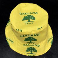 Front and top view of city of Oakland tree flag bucket hat, showing logo centered on top