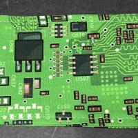 Close up of green printed circuit board fabric head scarf