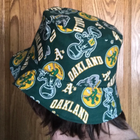 Example of same bucket hat in different fabric worn by adult woman