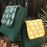 Slim tall messenger style cross body scorebook bag or satchel, canvas, vinyl bottom, white elephants on yellow