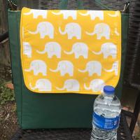 Slim tall messenger style cross body scorebook bag or satchel, canvas, vinyl bottom, white elephants on yellow