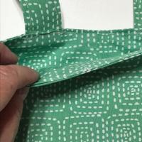 Simple small basic crutch bag, walker bag, scooter handlebars bag, bed rail caddy, white dashed squares on light green