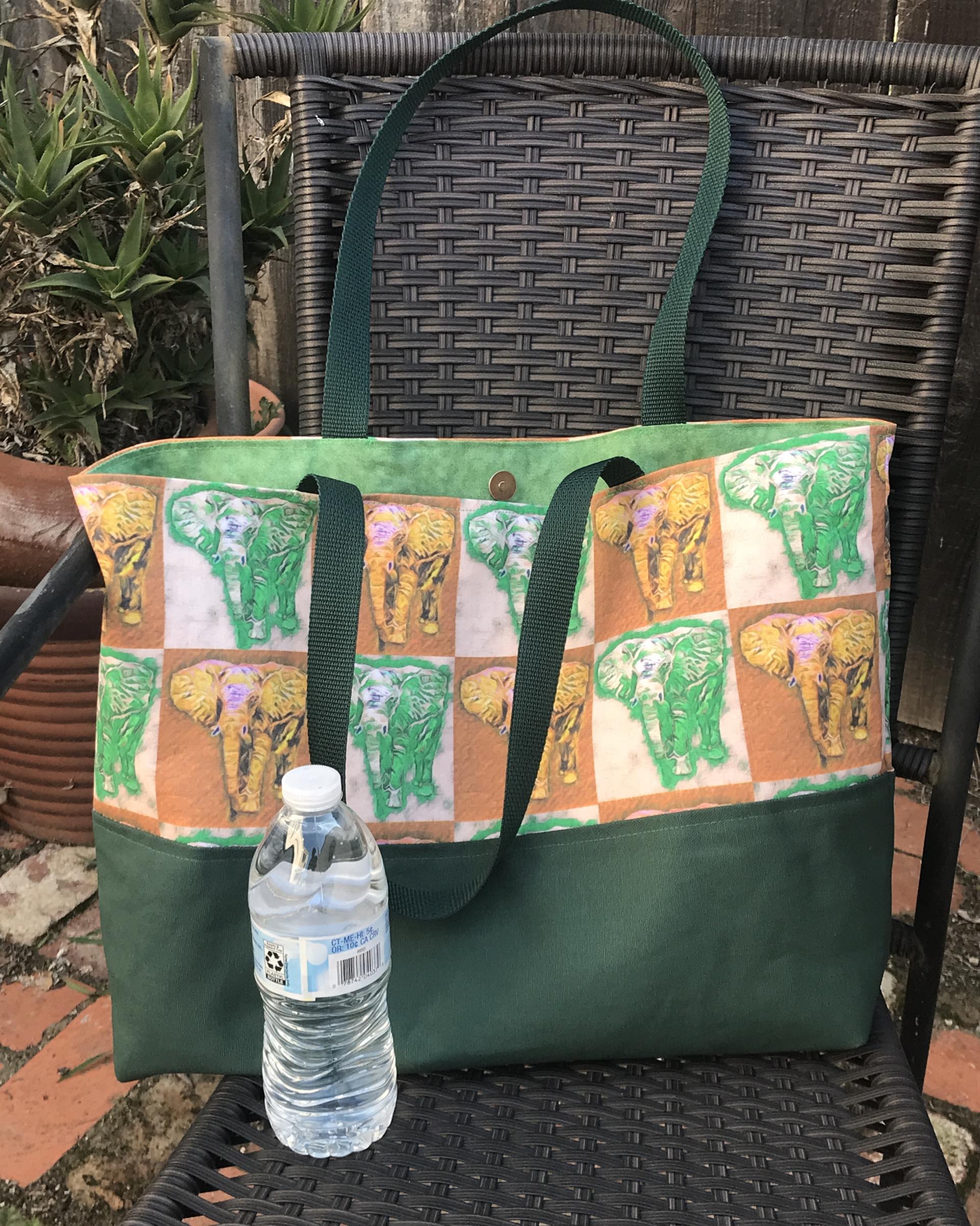 Tote bag, green & yellow elephants, water bottle  to show scale (not included)