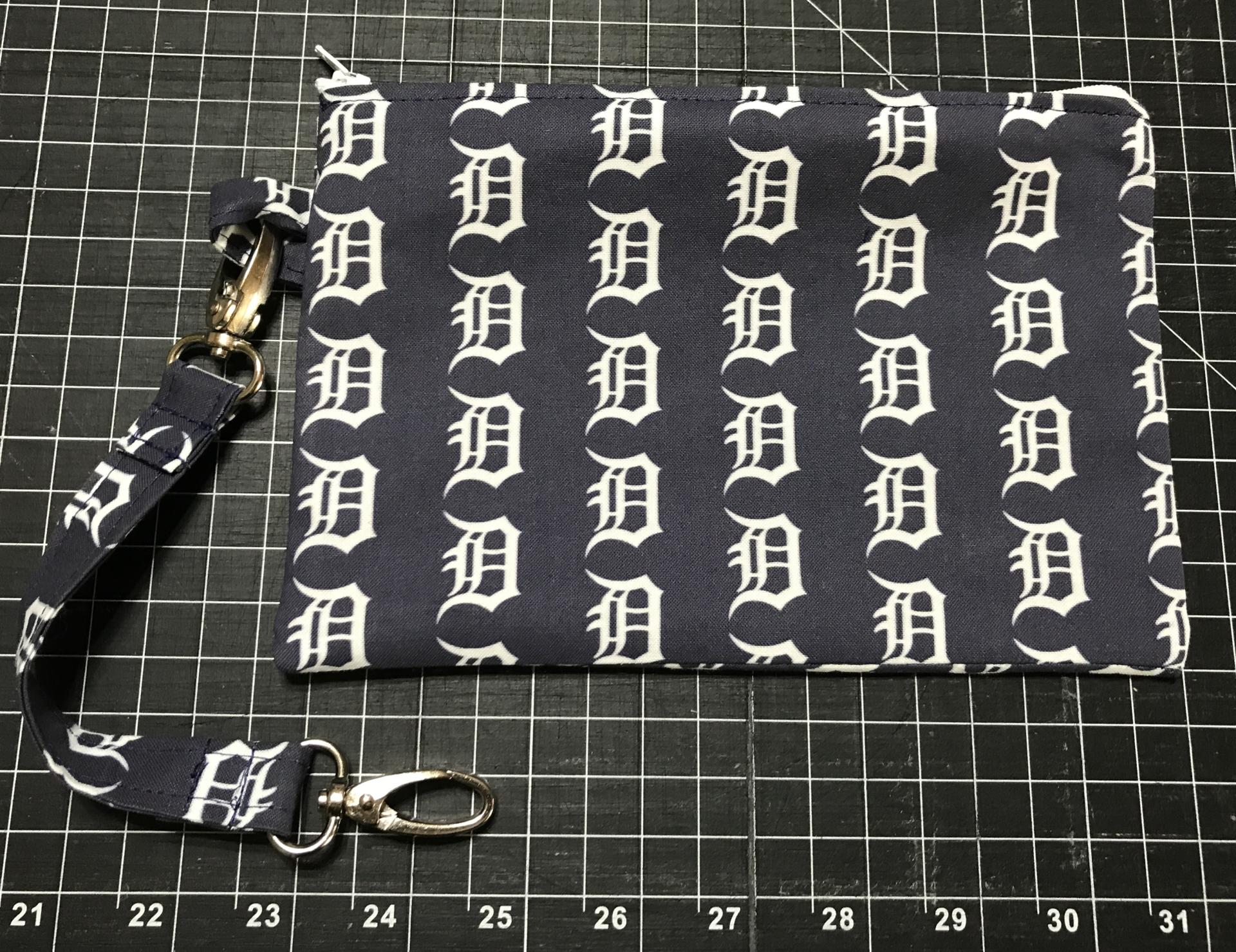 Zipper pouch and fob included with Old English D tote