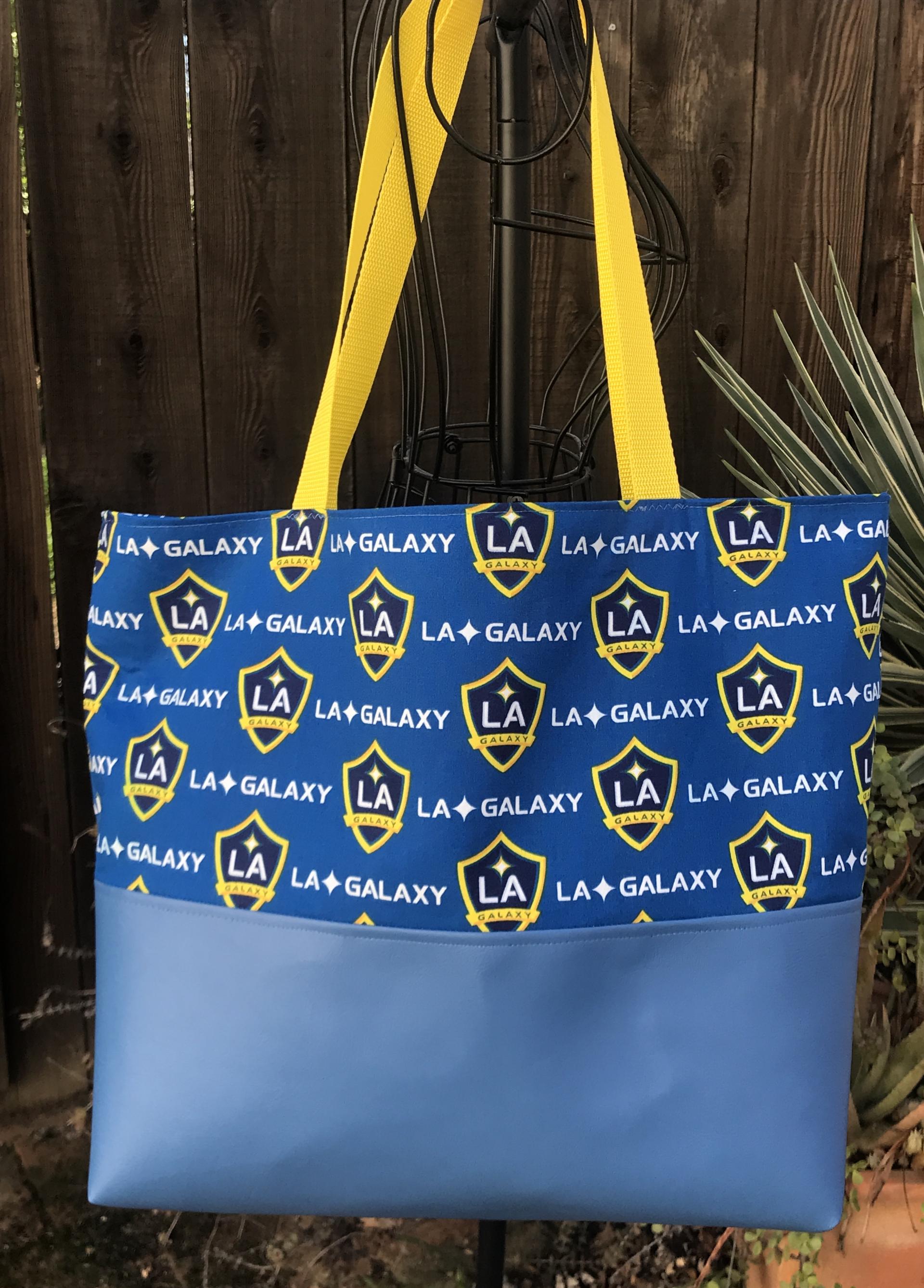 LA Galaxy tote bag, blue vinyl bottom, Galaxy print upper & lining, yellow straps