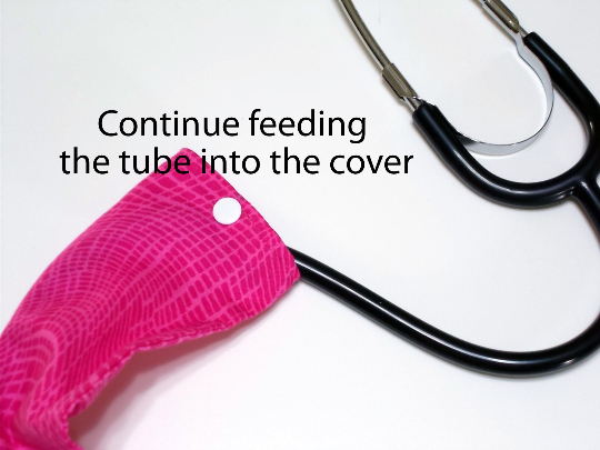 Continue to feed the tube into the stethoscope cover