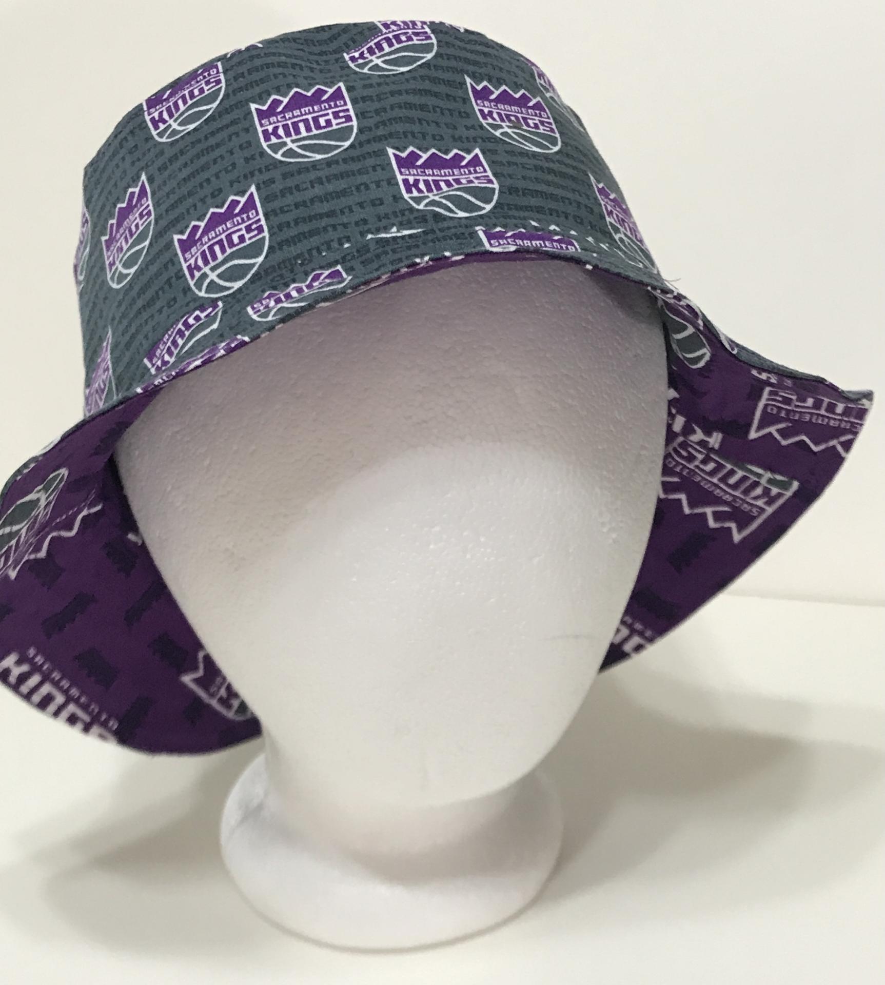 Front view, Sacramento Kings bucket hat, purple logo on grey background fabric facing out