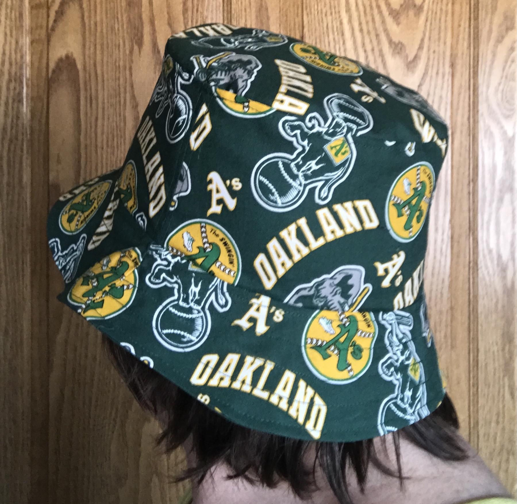 rsible Oakland A's Swingin' A's bucket hat, side view on person's head, handmade