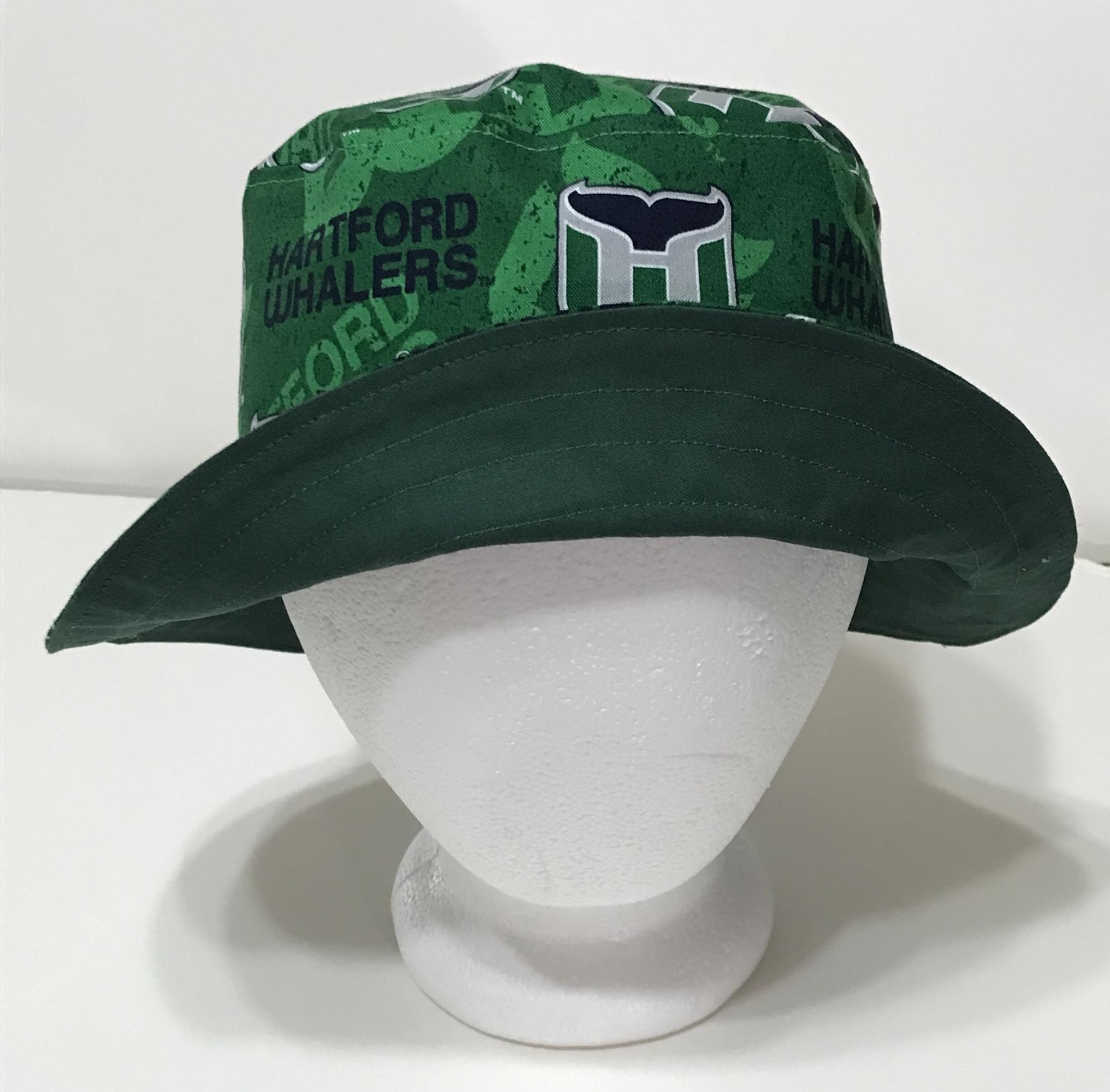 Front view with brim upturned to show solid green reverse, Hartford Whalers bucket hat, reversible, handmade