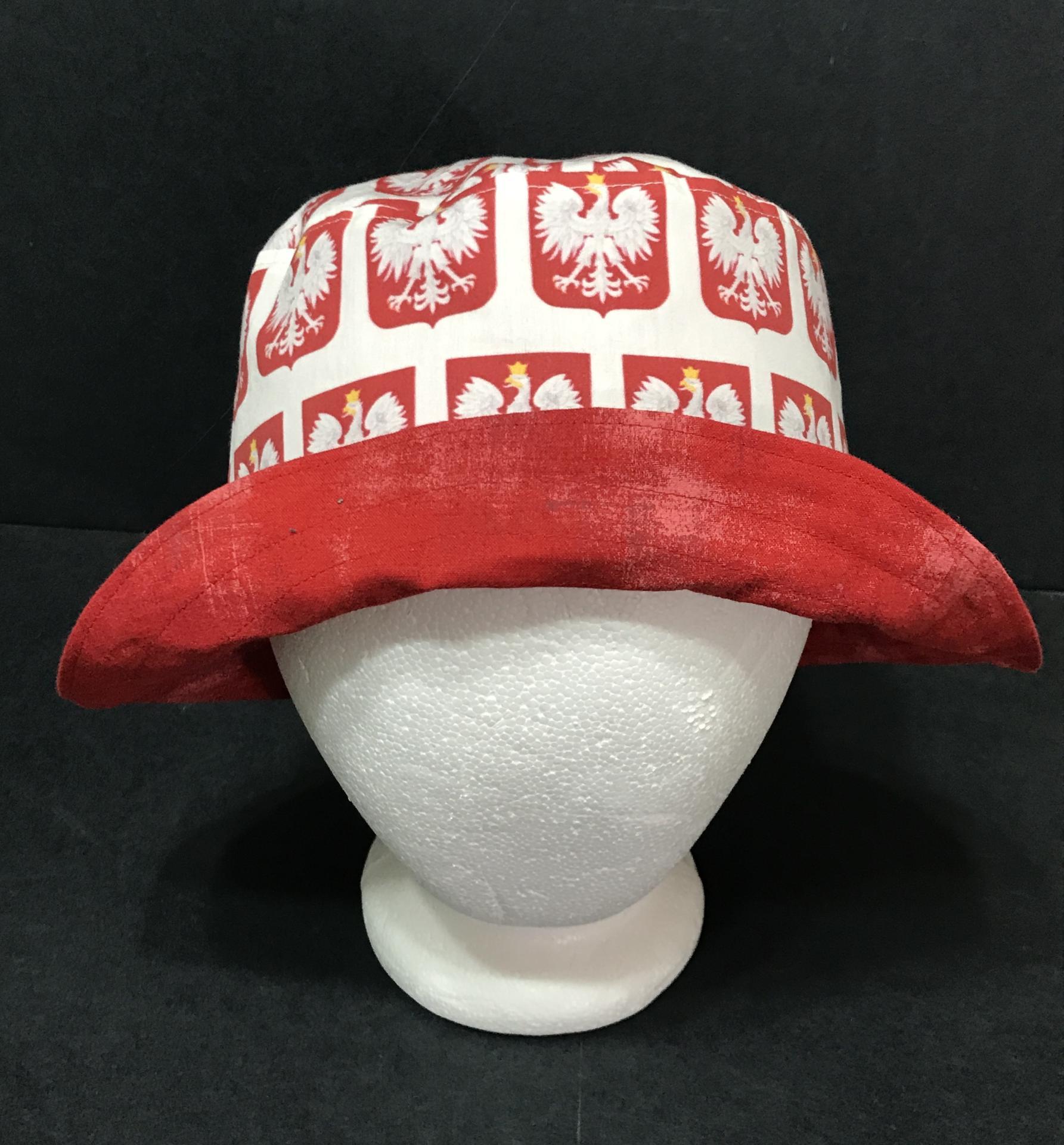 Front view of Polish eagles bucket hat, brim turned up to show red reverse 