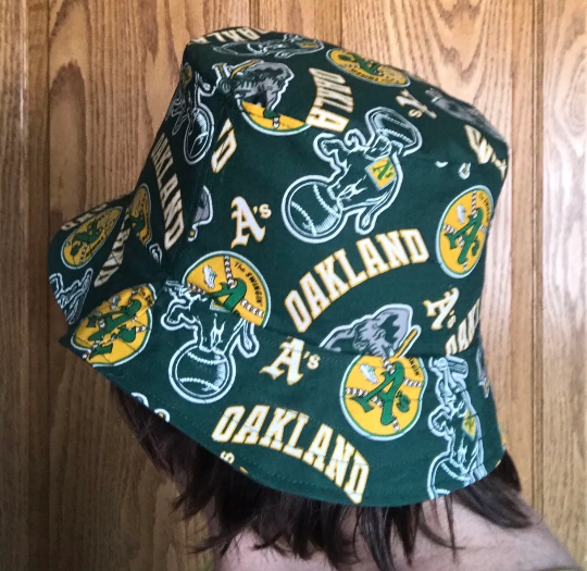 Example of same bucket hat in different fabric worn by adult woman