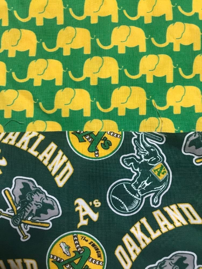 Yellow elephants on green background on revers of A's bucket hat