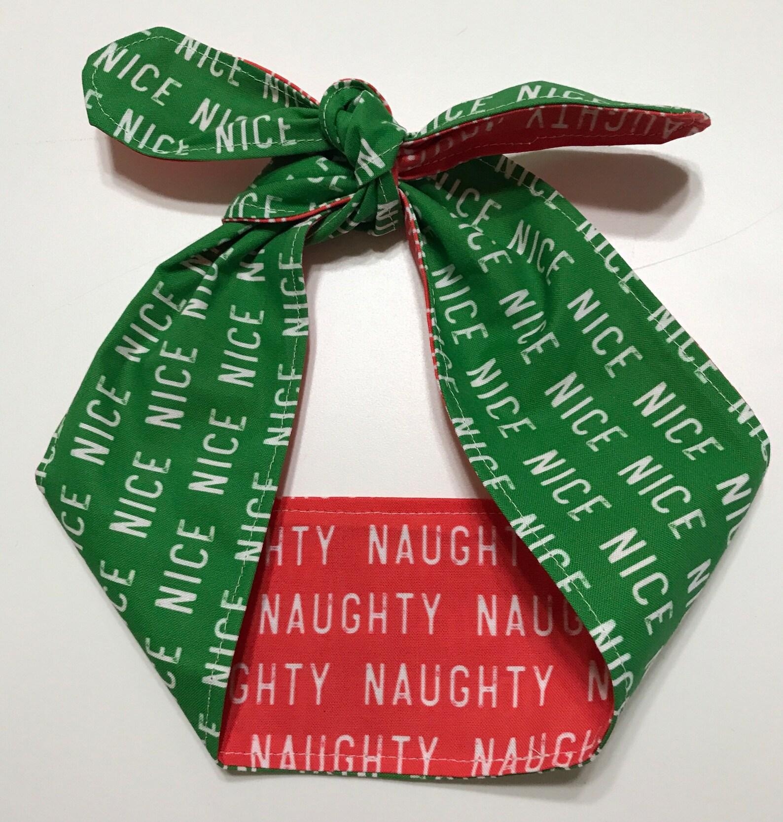 Christmas theme headband showing it tied on top, green Nice and red Naughty sides showing