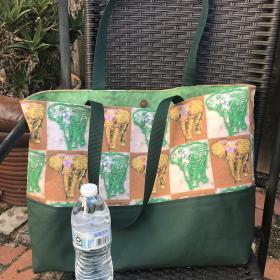 Tote bag, green & yellow elephants, water bottle  to show scale (not included)