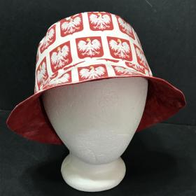 Front view of bucket hat, Polish eagles on red shields on white background 