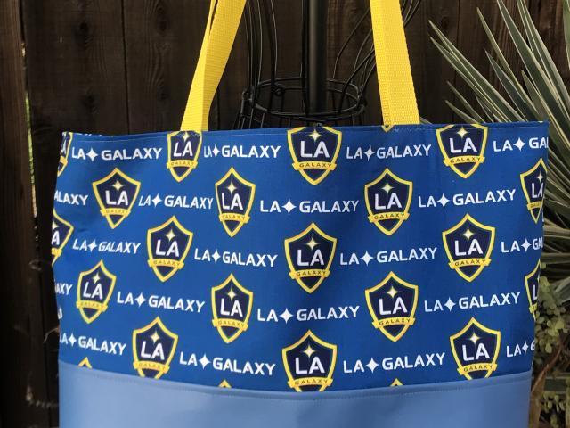 LA Galaxy tote bag, blue vinyl bottom, Galaxy print upper & lining, yellow straps