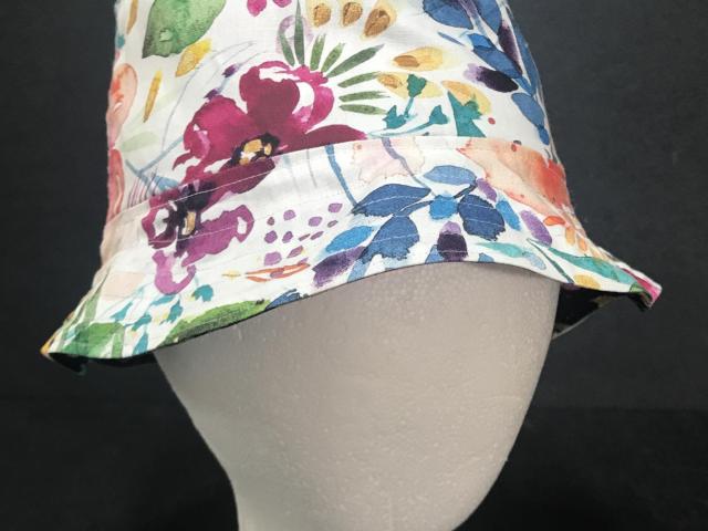 Watercolor floral print bucket hat, white backgound side facing out