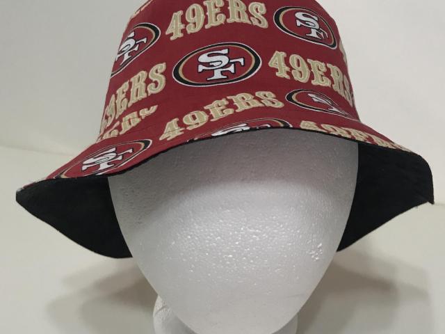 Front view, 49ers bucket hat, red, some black showing under brim