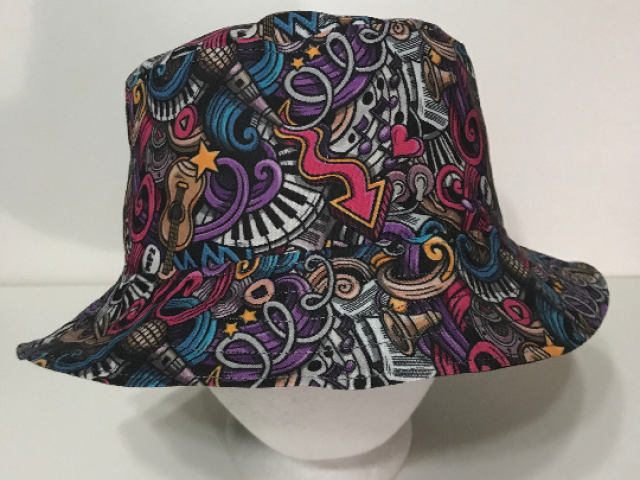 Front view, multicolored music theme bucket hat with doodle style print